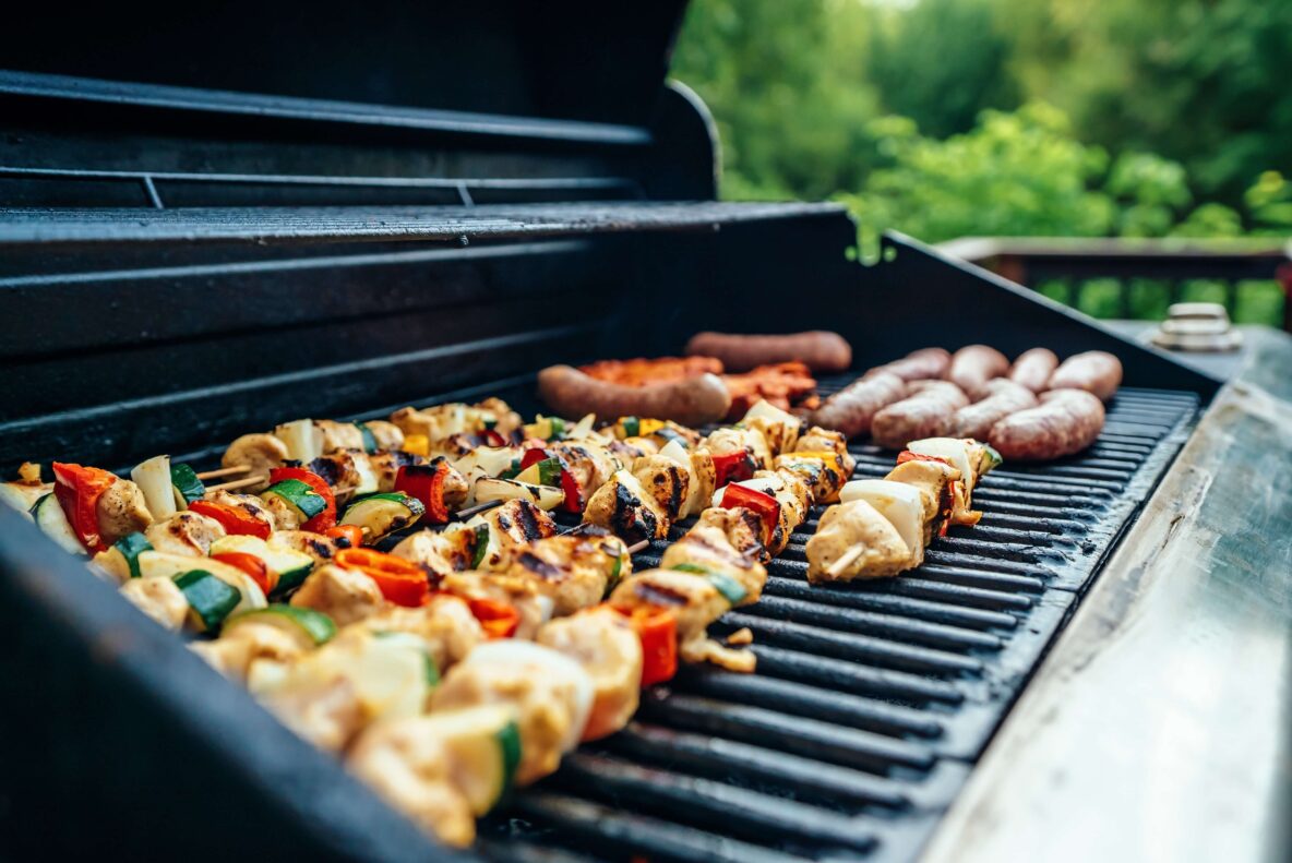 Meat and vegetables being grilled on a bbq