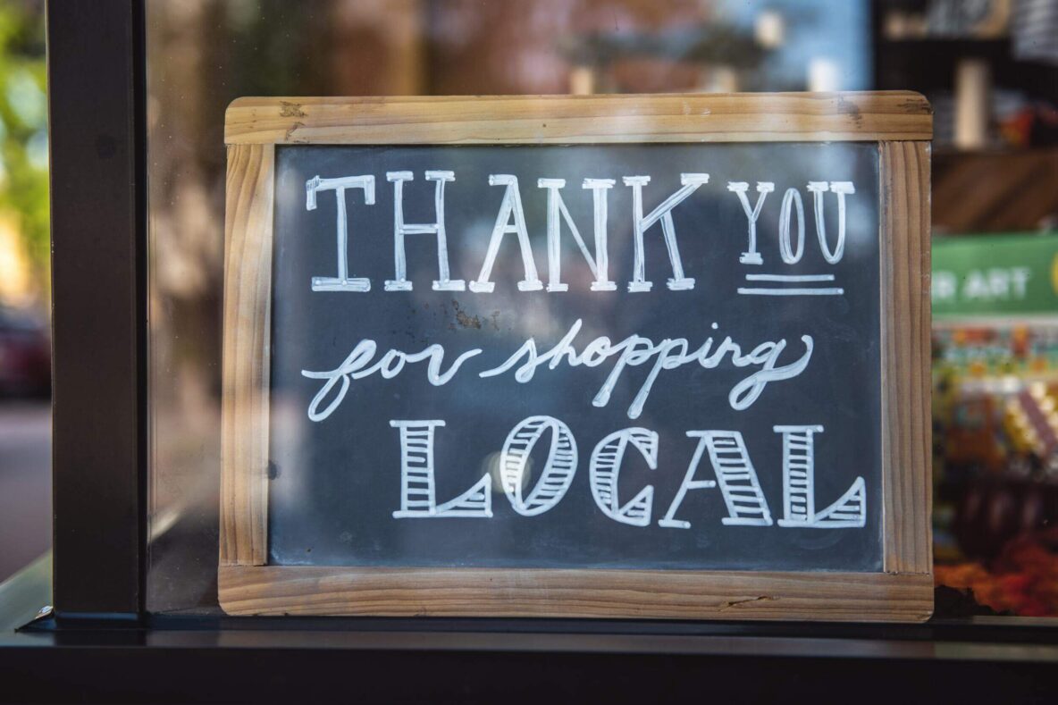 Thank you for shopping local written on a chalk board