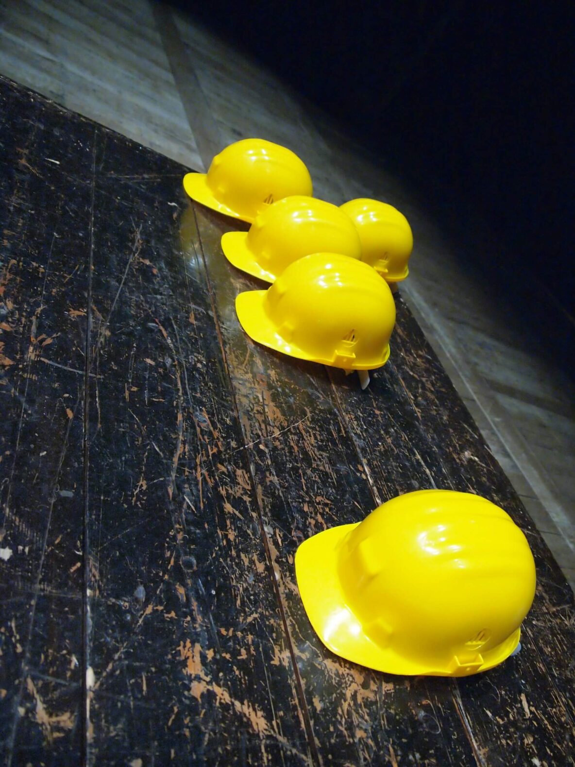 Hardhats sitting on a floor