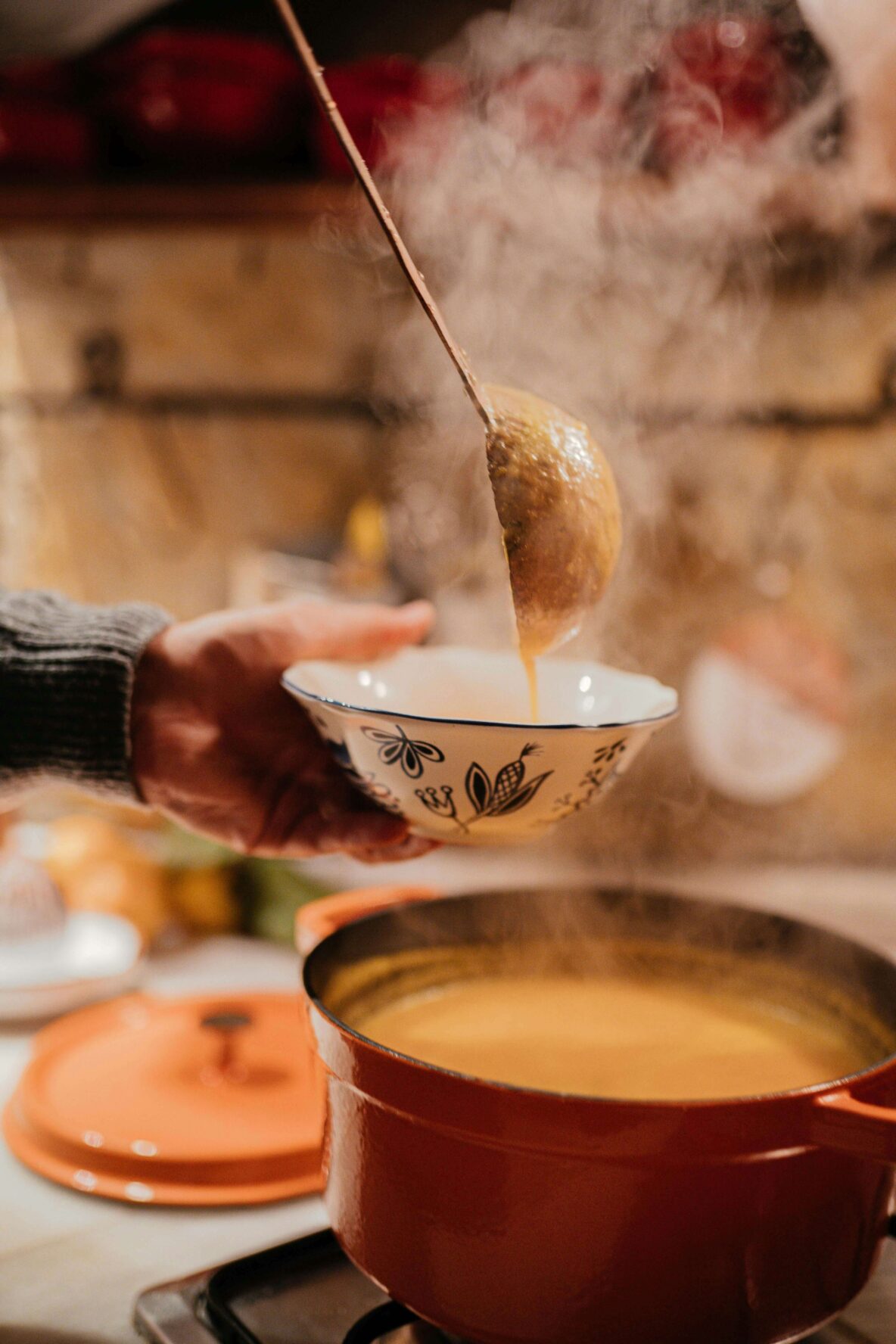 A hot bowl of soup being served.